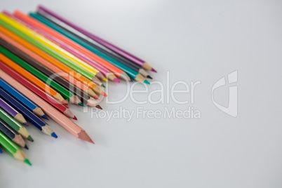 Colored pencils arranged in a wavy pattern