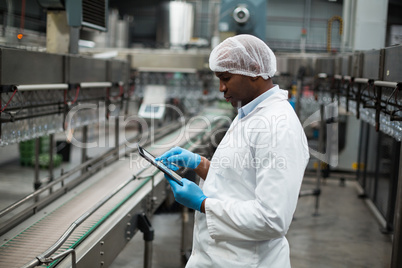 Factory engineer using digital tablet in the factory