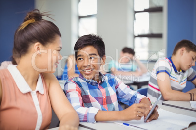 Student using mobile phone in classroom