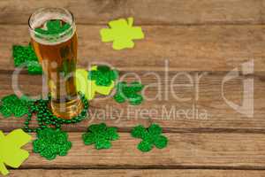 Glass of beer, beads and shamrock for St Patricks Day