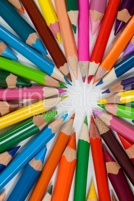 Close-up of colored pencils arranged in a circle