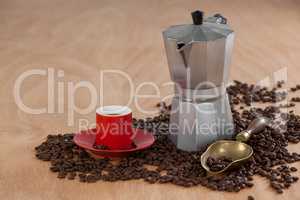 Coffee beans, coffee, coffeemaker and scoop