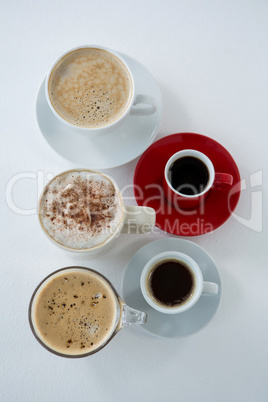 Different types of coffee arranged on white background