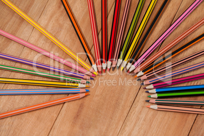 Colored pencils arranged in a semi-circle