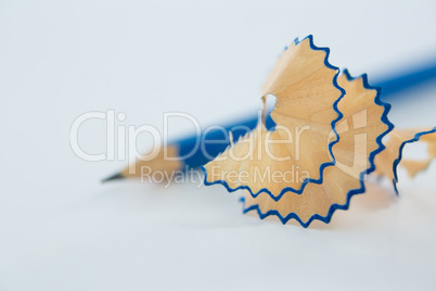 Close-up of blue pencil shavings with pencils