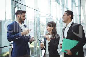 Businesses executives interacting with each other outside platform