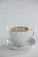 White cup of coffee with froth with creamy froth