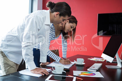 Man and woman working in office