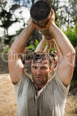 Soldierscarrying a tree log