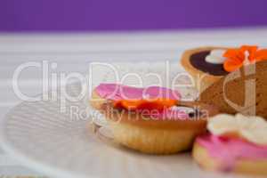 Close-up of various cookies arranged in plate