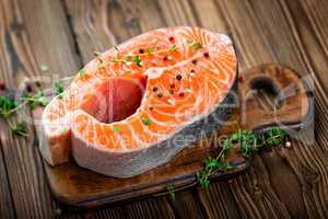 Salmon fish steak on wooden background