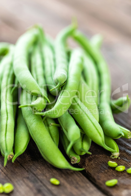 Fresh green beans on dark wooden rustic background