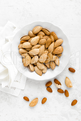 Almond nuts on white background directly above flat lay