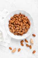 Almond nuts on white background directly above flat lay