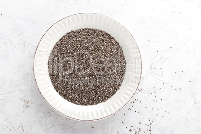 Chia seeds on white baclground directly above copy space