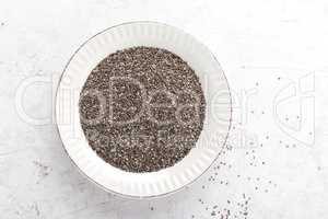 Chia seeds on white baclground directly above copy space