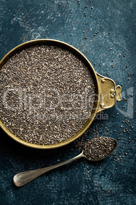 Chia seeds on white baclground directly above copy space