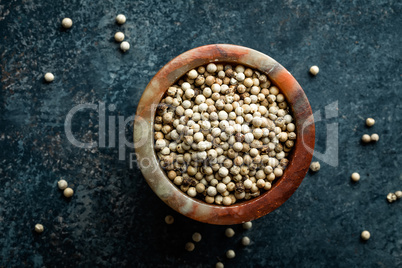 White pepper on dark background directly above copy space