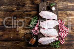 Raw turkey wings on wooden background top view, copy space, flat lay