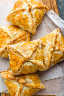 Crunchy puff pastry pies, homemade baking, top view