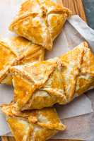 Crunchy puff pastry pies, homemade baking, top view