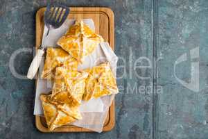 Crunchy puff pastry pies, homemade baking, top view