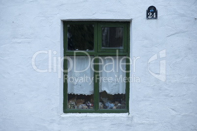 Old green wooden window of house