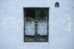 Old green wooden window of house
