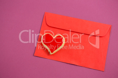 happy mother day card, heart shape cookie on red envelope against pink background