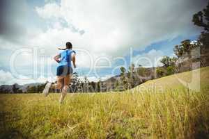 Fit woman running in bootcamp