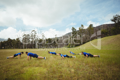 Fit people performing pushup exercise