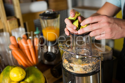 Shop assistant preparing avocado juice