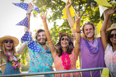 Group of friends dancing at music festival