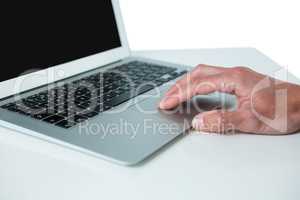 Hand of executive using laptop