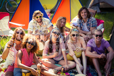 Group of friends having fun together at campsite