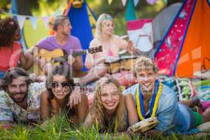 Group of friends posing together at campsite