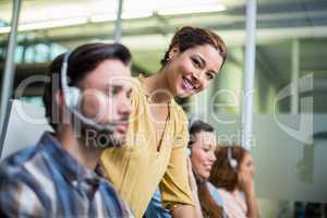 Portrait of smiling female executive at desk