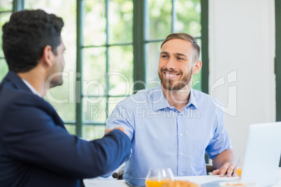 Businessmen shaking hands with each other