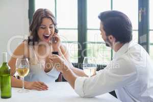Man proposing a woman with a ring