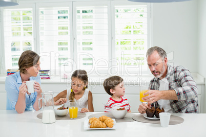 Family having breakfast in the kitchen