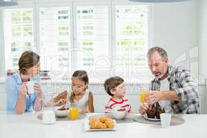 Family having breakfast in the kitchen