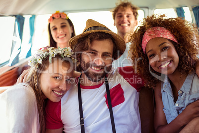 Group of friends sitting in campervan