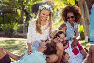 Friends having picnic in park