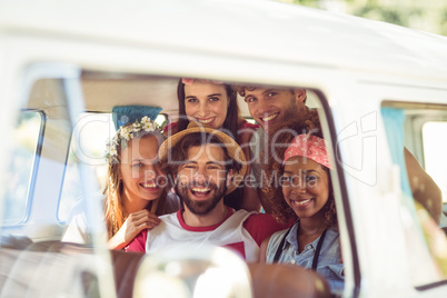 Portrait of friends having fun in campervan