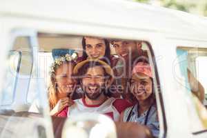 Portrait of friends having fun in campervan