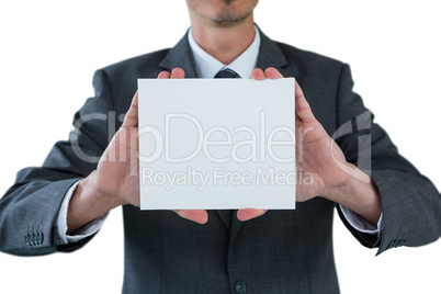 Businessman holding blank placard