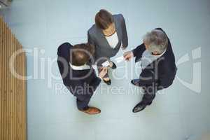 Business executives giving business cards to each other