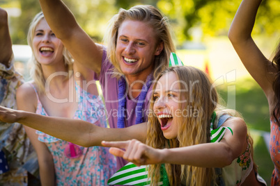 Group of friends dancing at music festival