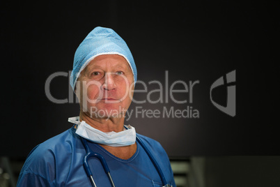 Portrait of male surgeon in scrubs