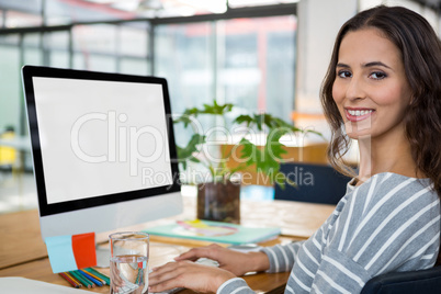 Female graphic designer working at desk